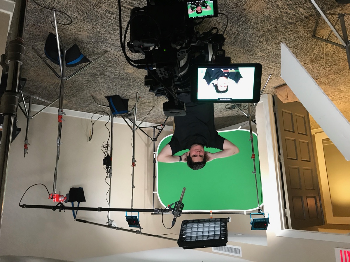 Javi in his green screen studio with full production setup